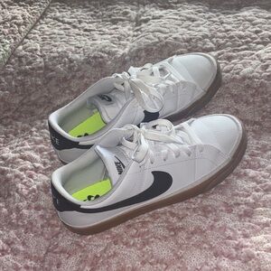 Nike White Sneakers with Black Swoosh and Gum Sole